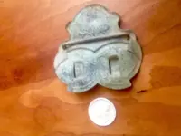 back of brass clip or buckle.webp