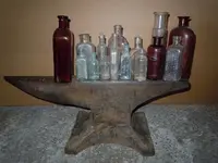 Bottles on Anvil.webp