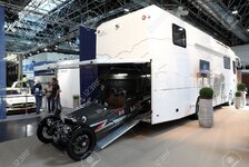 22034238-DUSSELDORF-SEPTEMBER-4-ACE-Cycle-Car-in-a-garage-of-a-large-RV-at-the-Caravan-Salon-Exh.jpg