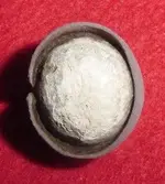 Round ball with wedding band around it.webp