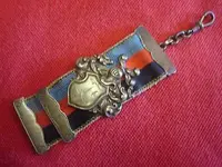 orig-ww1-german-soldiers-watch-fob-w-inscription-w-ribbon-knights-helmet-shield-4a5c64cf54d57...webp