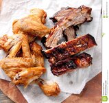 chicken-wings-pork-ribs-juicy-barbeque-dry-glaze-hot-sauce-side-62607647.jpg