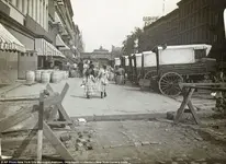 1890 photo, a pair of girls walk east along 42nd Street..webp