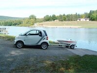 smart-car-with-towing-tiny-boat.jpg
