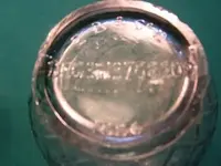 green hourglass bottle.webp