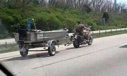 motorcycle_towing_boat_is_not_something_you_see_everyday__5800136663.jpg
