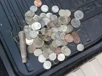 coin dump on mat.webp