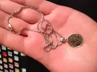 Found necklace-coin.webp