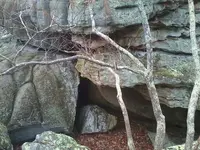 traingle cave with block and possibly carved above.webp