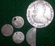 coins from Spain one has been cut to make small change.jpg