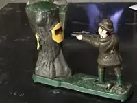 vintage-cast-ironmechanical-coin-bank-hunter-shooting-bear-in-tree-79e6b6b2028d1764ddaebd3964...webp