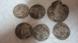6 silver coins in baseball field 021.webp