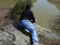 Dex overlooking the line of rocks.webp