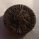 brass-round-intricate-hollow-front.webp