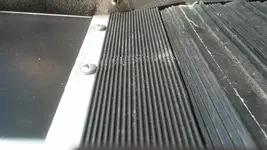 Ribbed mat on metal flashing.webp