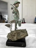 Malcolm-Moran-Huck-Finn-bronze-sculpture.webp