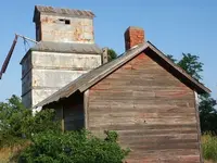 Abandoned buildings at the former townsite of Georgia.webp