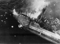 Japanese_crew_going_over_side_as_Kitsugawa_Maru_sinks_at_Apra_Harbor_1944.jpg