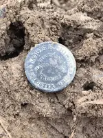 CW store card in dirt.webp