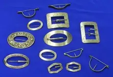 thirteen-sterling-silver-sash-buckle-and-bouquet-pins.webp
