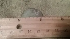 Possible coin with ruler.webp