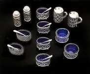 23609426--r58051--t1507977781--sa1eb--sterling-and-cobalt-glass-salt-cellars-and-pepper-normal.webp