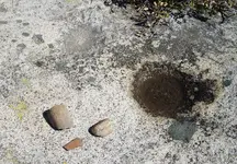 Grinding Holes and Broken Manos with Pottery Shard.webp