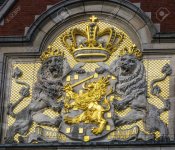 77430082-netherlands-coat-of-arms-amsterdam-holland-netherlands-on-building-facing-the-canal-als.jpg