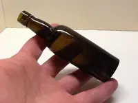 Small-Antique-Olive-Amber-Sample-Size-Whiskey-Bottle.webp