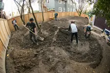 the-whole-team-pitches-in-to-help-move-dirt.webp