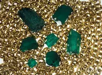 emerald-rough-and-gold-chain-Nuestra-Senora-de-Atocha.webp