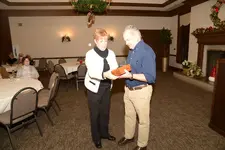 Giving Vickie her gift.webp