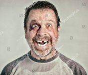 stock-photo-you-should-see-the-other-guy-a-man-who-is-apparently-happy-to-be-beaten-up-426565912.jpg