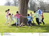ring-rosie-group-children-two-adults-holding-hands-dance-around-trunk-tree-57219074 rosie.jpg