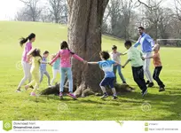 ring-rosie-group-children-two-adults-holding-hands-dance-around-trunk-tree-57219074 rosie.webp