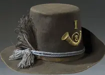 CW hat insignia letter.webp