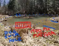 Dug swim hole fill to upstream dam embankment.webp