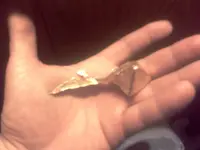 first pour gold in hand.webp