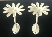 Pair-Of-Daisy-Cast-Iron-Curtain-Tie-Backs.webp