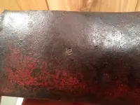 red paint axe head stamped E 003.webp