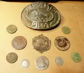 gary\'s belt buckle and coins.webp