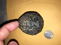 Object with sandy dirt and size weighs 19 oz.webp