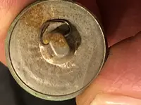 back of regi button.webp