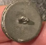 bavk of fleur de lys button.webp