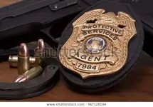 fake-prop-badge-bullets-handgun-600w-567128194.webp