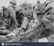 wounded-soldier-given-blood-plasma-between-motoyama-airstrip-2-and-purple-beach-on-d-plus-3-d...webp