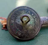 backside M.M.A. Button.webp