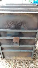 Tent stove bottom showing folding legs.webp