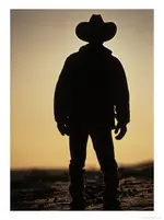321111~Silhouette-of-Cowboy-at-Sunset-Posters.webp