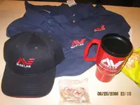 PRIZE 20 MUGS 20 PINS 6 CAPS mINELAB AND RIVERRAT.webp
